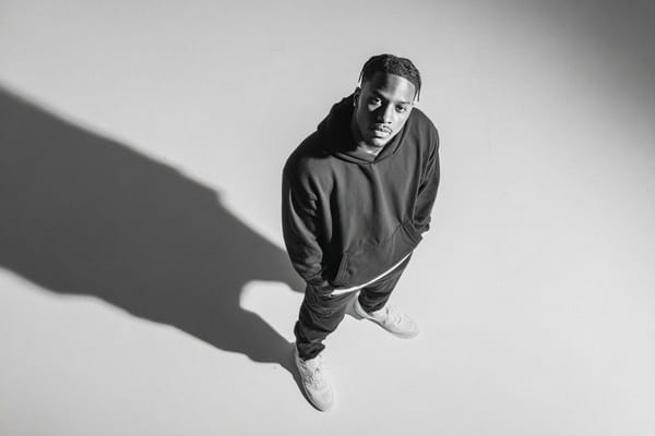 A [subject] photographed from a 35-degree overhead angle, standing alone in an off-white studio voi… prompt example
