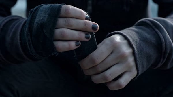 00:00 – 00:01 Close-up of slender hands wrapping faded black cloth tape around knuckles. Subtle tre… prompt example