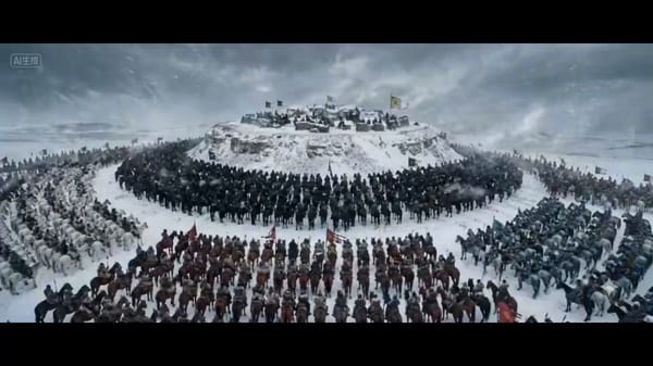 西汉史诗，雪地战场，电影级质感，冷色调，白登之围，汉军与匈奴骑兵对峙，宏大战场，风雪交加，15秒短视频，分镜头脚本： 1. 全景合围：漫天风雪的白登山下，汉军白甲白马与匈奴黑甲黑马、青灰甲青马形成环… prompt example