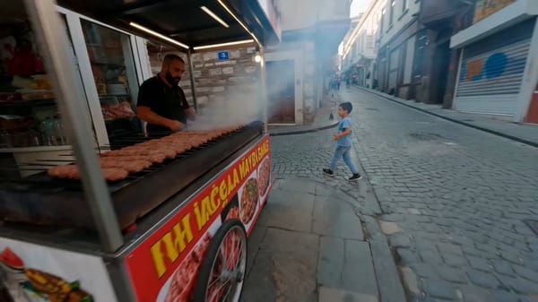 High-speed, continuous FPV drone shot navigating through the vibrant, authentic backstreets of…