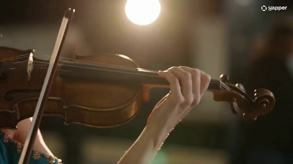 [0–3s] Close-up shot of a young woman's hands drawing a bow across violin strings in a dimly li…