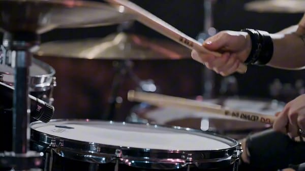 Create a high-energy cinematic character study video for a punk rock session drummer named Riley “R… prompt example