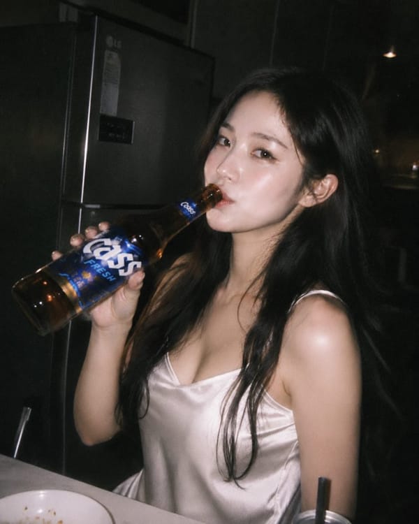 Ultra-realistic candid night photography of a beautiful East Asian woman with long black hair weari… prompt example