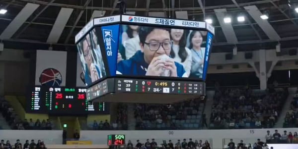 A photorealistic, cinematic live television broadcast video set in a crowded indoor sports aren…
