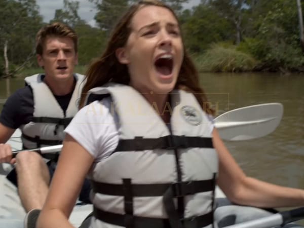 Cinematic action horror scene on a sunny Australian river surrounded by lush green jungle. A young… prompt example