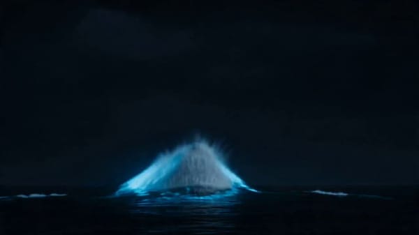 [0-3s] Ocean surface at night. Absolute black water. Massive bioluminescent shapes moving far b…