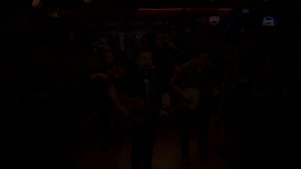 Start from pure black screen. Fade in to a high-production bluegrass music video with clean, sharp… prompt example