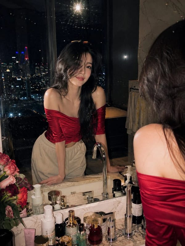 Ultra-realistic cinematic night portrait photography of a beautiful young woman standing at a l…