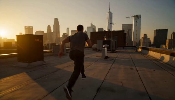A cinematic 15-second parkour chase sequence at golden hour in a dense modern city. A skilled a…