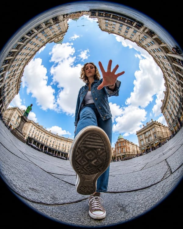 Ultra-realistic action photography, extreme fisheye lens, 8mm, worm’s-eye view from ground level, d… prompt example