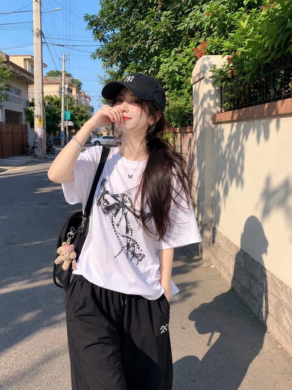 Beautiful young Japanese girl with fair skin, soft natural makeup, and long dark hair tied in a low… prompt example