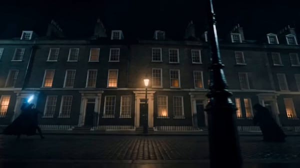 A cinematic, wide-angle shot of a mysterious, dark London street at night, wet cobblestone grou…