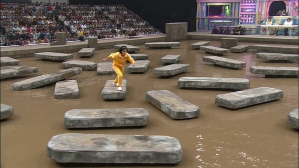 Authentic 1980s Japanese game show broadcast style, realistic recreation of Takeshi's Castle fo…
