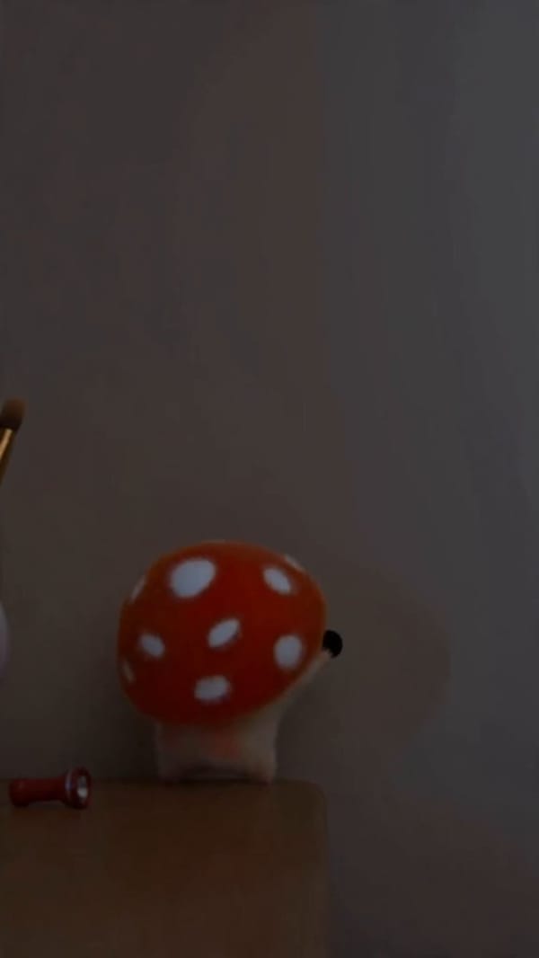 00:03 a fuzzy mushroom character spoons fruit into a bowl prompt example