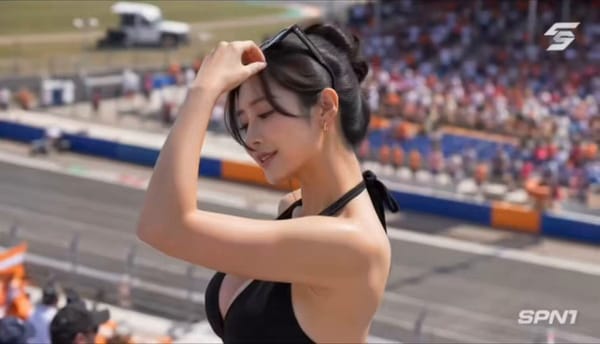 主要角色：年轻东亚女性，黑色高丸子头搭配随性碎发，头顶架着黑框墨镜，金色小巧耳饰，黑色挂脖深V连体阔腿裤，健康细腻的皮肤质感，妆容精致明艳，神态松弛又有感染力。在整个视频中保持一致的身份、服…