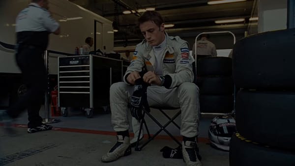 Main subject: young professional open-wheel race driver, early 20s, lean athletic build, natural fo… prompt example
