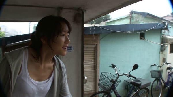 Main Subject: Young Korean woman, early 20s. Natural appearance. Black wavy hair loosely tied i…