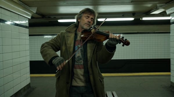Main subject: street violinist, early 50s, weathered wool coat over a faded band tee, fingerless gl… prompt example
