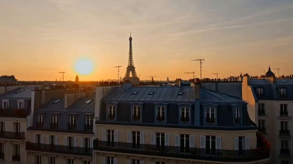 Create a 15-second cinematic luxury travel advertisement set in Paris. A young traveler arrives…