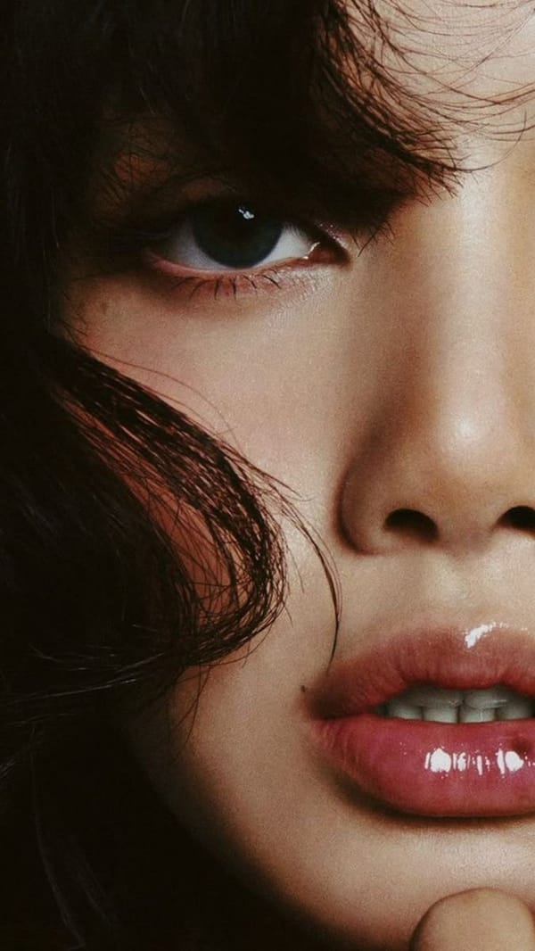 An ultra-realistic editorial beauty portrait featuring an exceptionally attractive young East A…