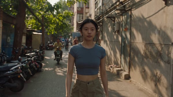 A young Shijiazhuang girl walks through an old residential neighborhood in Shijiazhuang, Hebei,…