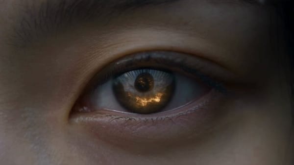 A cinematic dark fantasy epic video in 8K resolution. Extreme macro close-up of a female warrio…