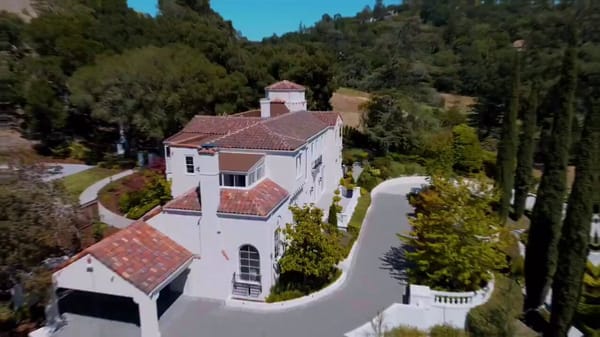 Cinematic luxury real estate drone and interior tour of a stunning white Mediterranean-style vi…