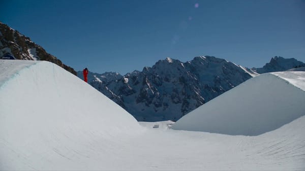 Ultra-photorealistic professional snowboarding footage of an athlete in full winter competition…