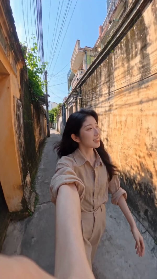 Create a 15-second vertical 9:16 selfie hyperlapse featuring the uploaded adult woman traveling…