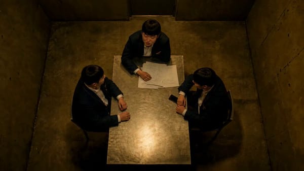 A cinematic live-action anime battle in a dark concrete room. A young East Asian girl with slee…