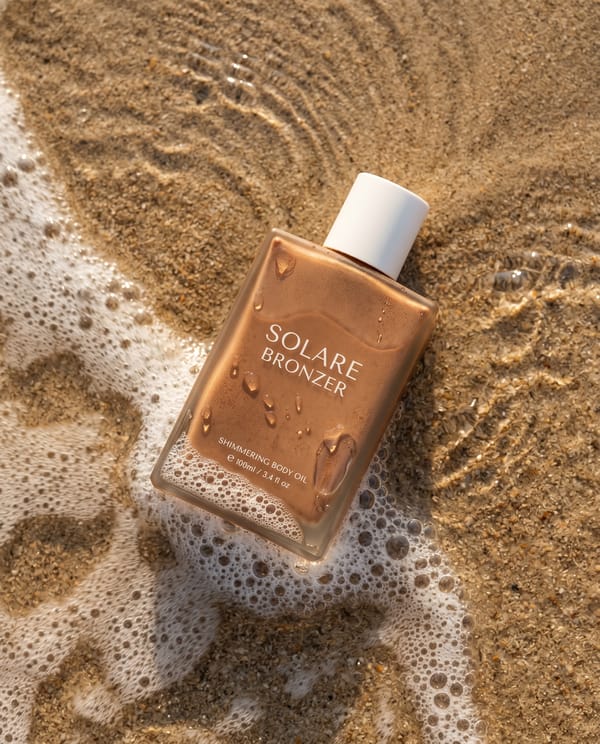 Ultra-realistic summer beauty product photography: bronzer bottle. Rectangular matte bottle in…