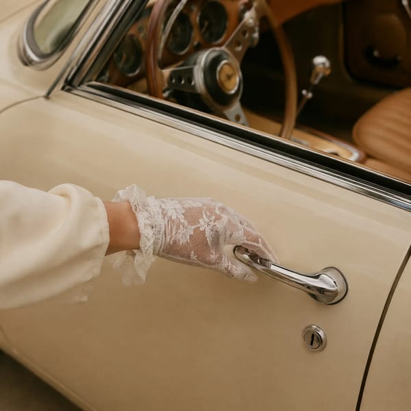Close up lifestyle fashion photography, elegant female hand wearing a delicate white lace glove…